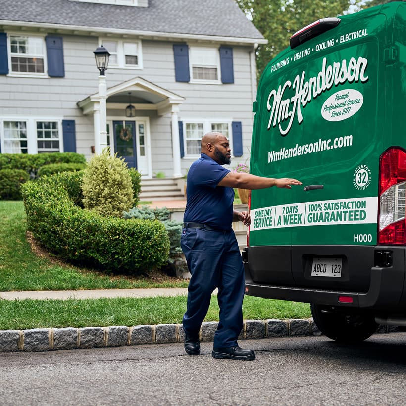 A Wm Henderson technician arrives at a home ready to provide expert HVAC, plumbing, and electrical services.
