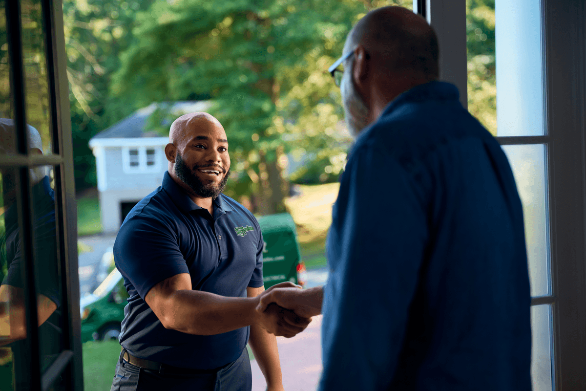 Technician shaking customers hand