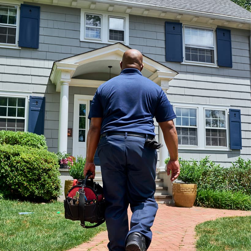 A Wm Henderson technician arrives at a home ready to provide expert HVAC, plumbing, and electrical services.